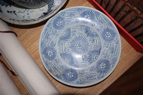 A Chinese blue and white deep plate decorated with a dragon and two other items